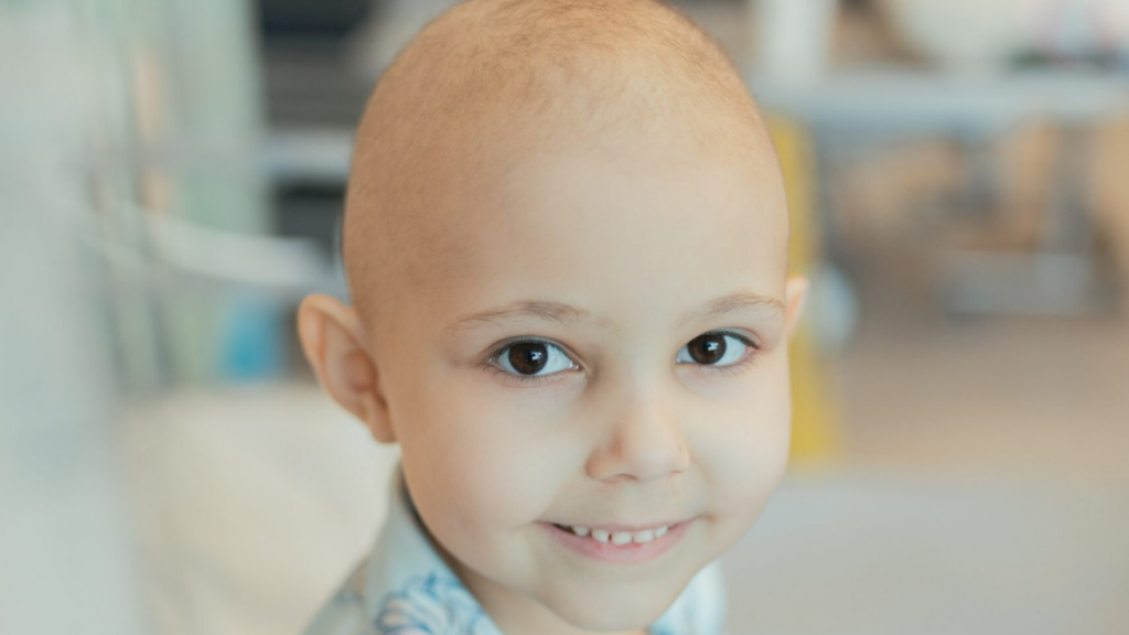 Image shows child Darcie smiling