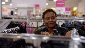 Picture shows a retail volunteer working in the Newlife superstore