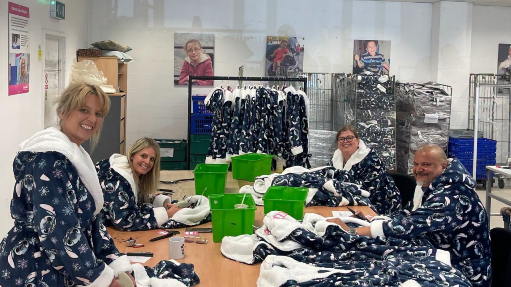 PIcture shows a group of volunteers in the Newlife opportunities centre